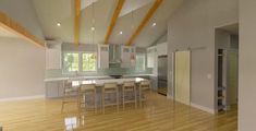 an empty kitchen and dining room with hard wood floors