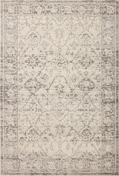 an area rug with grey and white colors