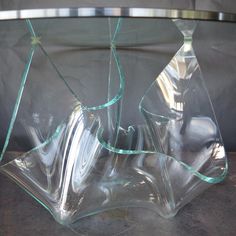 a broken glass vase sitting on top of a table