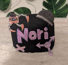 a sign that says nori with an arrow pointing to it