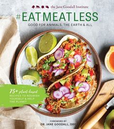 the cover of eat meatless cookbook, featuring two tacos and limes