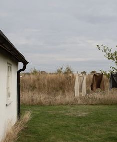 clothes hanging out to dry outside in the grass