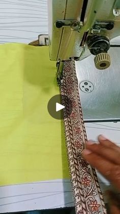 someone is using a sewing machine to sew fabric