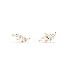 These dainty studs feature three Marquise shaped crystals aligned in a curve and set in Gold Vermeil. 14K Gold over Sterling Silver Cubic Zirconia Baguette and Tapered Baguette Crystals Hypoallergenic post Length 6mm x Width 4.4mm #E177 Dainty Studs, Solid Gold Jewelry, Gold Vermeil, Cubic Zirconia, Natural Diamonds, Solid Gold, Gold Jewelry, Gold Plate, Stud Earrings