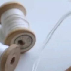 two spools of thread are sitting next to each other