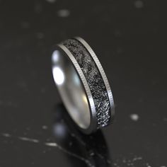 a wedding ring with an intricate design on it