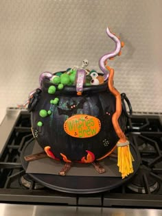 a witches caulder cake on top of a stove