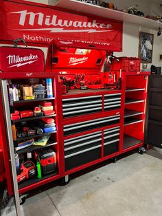 a red tool cabinet with tools in it