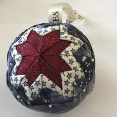 an ornament with a red star on it