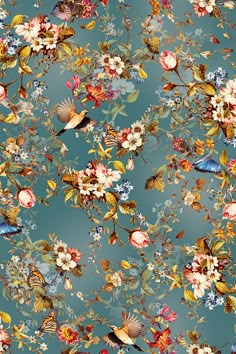 a blue floral wallpaper with lots of flowers and birds on the top of it