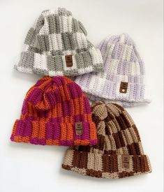 three knitted hats sitting next to each other