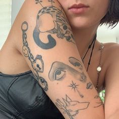 a woman with a tattoo on her arm