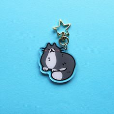 a keychain with a cartoon character on it's face and star in the background