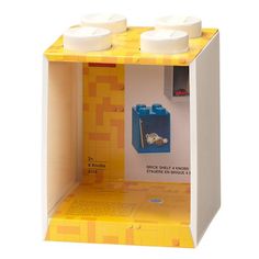 a yellow and white box with two legos in it