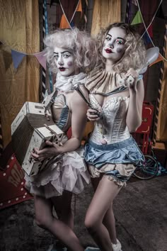 two women dressed up as clowns posing for the camera