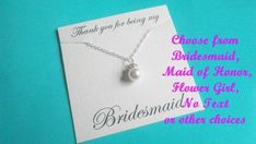 the bridesmaid necklace has a pearl on it