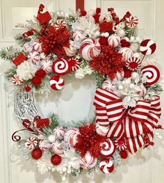 a wreath decorated with candy canes and ornaments