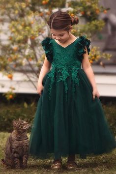 Fit for a princess, this dress has it all. Regal emerald satin graced with a touch of lace, this dress is a showstopper! Sleeves are embellished with whimsical die cut flowers that will have all eyes on her. Tulling overlay skirt adds just the right touch of fullness and twirl. This is a gorgeous full length gown and incredible value for a gown of this caliber. Fully lined with soft cotton, back zip. 100% poly self, 100% cotton lining. Machine wash, hang dry. Trish Scully, Green Flower Girl Dresses, Fancy Frocks, Overlay Skirt, Full Length Gowns, Full Length Skirts, Wedding Dresses For Girls, Popular Dresses, A Line Gown