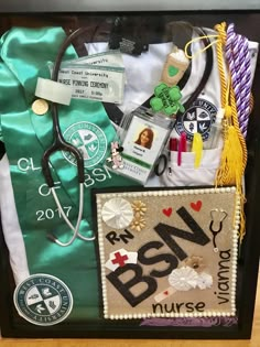 an assortment of medical items is displayed in a shadow box on a table with green satin