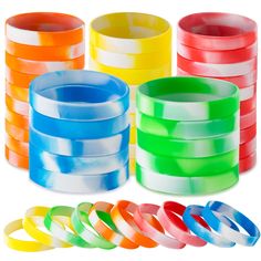 many different colored bracelets stacked on top of each other