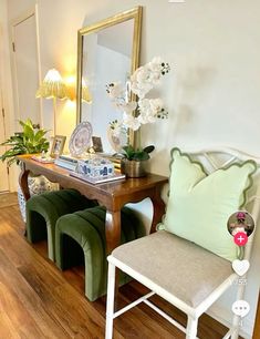 a living room filled with furniture and a mirror on the wall next to a wooden floor