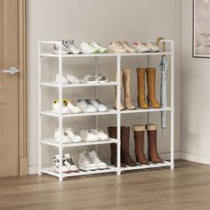 several pairs of shoes are lined up on a shelving unit in the corner of a room