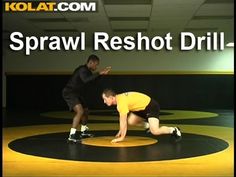 two men in yellow shirts and black shorts on a wrestling mat with the words sparw