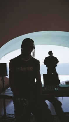 a man standing in front of a dj booth