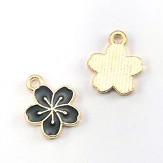 front and back gold and black flower shaped jewerly charms Black Flower Charm Pendant Jewelry, Black Jewelry With Flower Charm Pendant, Black Flower Charm Jewelry, Black Metal Flower Jewelry, Black Flower-shaped Metal Jewelry, Gold Flower Charm For Jewelry Making, Necklace Keychain, Charms Bracelet, Gold Alloys