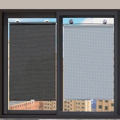 an open window with the view of city buildings through it's mesh coverings