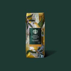 a bag of starbucks's veranda coffee on a dark green background with leaves