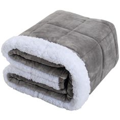 two blankets folded on top of each other in grey and white colors with fluffy edges