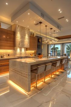 a large kitchen with an island in the middle and lots of counter space on each side