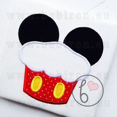 mickey mouse face with red cupcake appliqued on white t - shirt