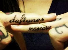 two hands with tattoos that say deftones mascara