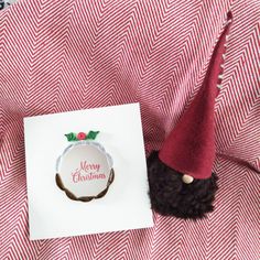 a christmas card with a gnome's hat on it