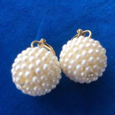 "1950s 1960s Vintage Pearl Beads Clip On Earrings Mid Century Hollywood Regency Rockabilly Great looking cluster beaded pearl earrings. Clip on, measure about 3/4\" diameter. One small clear rhinestone in the center to add that accent sparkle! Can be worn formal or just to match your simple set of pearls... Please see photos." Pearl Beaded Earrings For Party, Elegant Round Bead Clip-on Earrings For Party, Elegant Party Clip-on Earrings With Round Beads, Evening Beaded Earrings With Round Beads, Vintage Beaded Earrings For Party, Party Pearl Earrings With Beaded Detail, Beaded Pearl Earrings For Party, Retro Beaded Dangle Jewelry, Party Beaded Pearl White Earrings