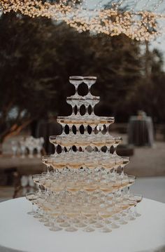 a glass cake sitting on top of a white table