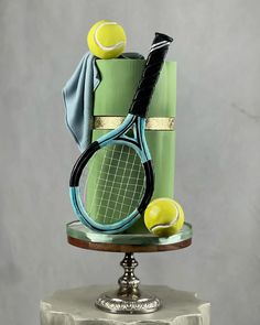 a cake made to look like a tennis racket and balls