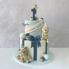 a birthday cake with teddy bears on top