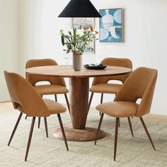 a table with six chairs around it and a vase on the table next to it