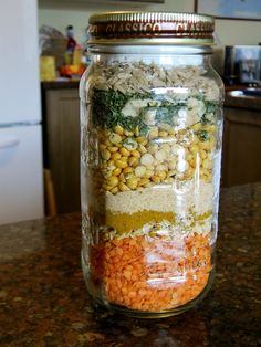 a glass jar filled with food sitting on top of a counter