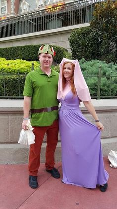 a man and woman dressed up in costumes