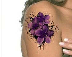 a woman's shoulder with purple flowers painted on the upper half of her arm