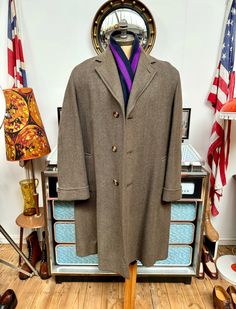 Here we have a stunning Vintage or possibly Antique overcoat from WW2 era by Bonds of Chelmsford. This is possibly around 75 years old but you certainly wouldn't think it,amazing condition for its age. Very thick herringbone weave in browns/green grey mi,have taken some close ups for your pleasure. Styled and made to be worn over underwear/shirt/tie 3 piece suit and even maybe a jumper ,large shoulders for such a thing so please bare this in mind,in its day this was possibly a coat for a 38" che Vintage Long Winter Sport Coat, Vintage Wool Coat With Buttons For Formal Occasions, Vintage Single Breasted Wool Coat, Vintage Formal Wool Coat, Vintage Tailored Sport Coat With Herringbone Pattern, Vintage Long Wool Coat With Pockets, Vintage Brown Outerwear With Herringbone Pattern, Vintage Brown Wool Coat, Vintage Herringbone Blazer With Notch Lapel