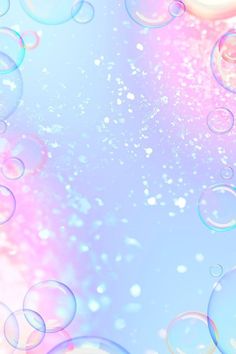 soap bubbles floating in the air on a blue and pink background