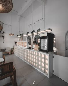 the interior of a restaurant with white walls