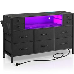 a black cabinet with purple light in the top and bottom drawers on both sides is shown