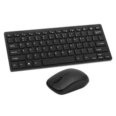 a computer keyboard and mouse sitting next to each other