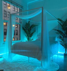 a bed in a room with blue lights